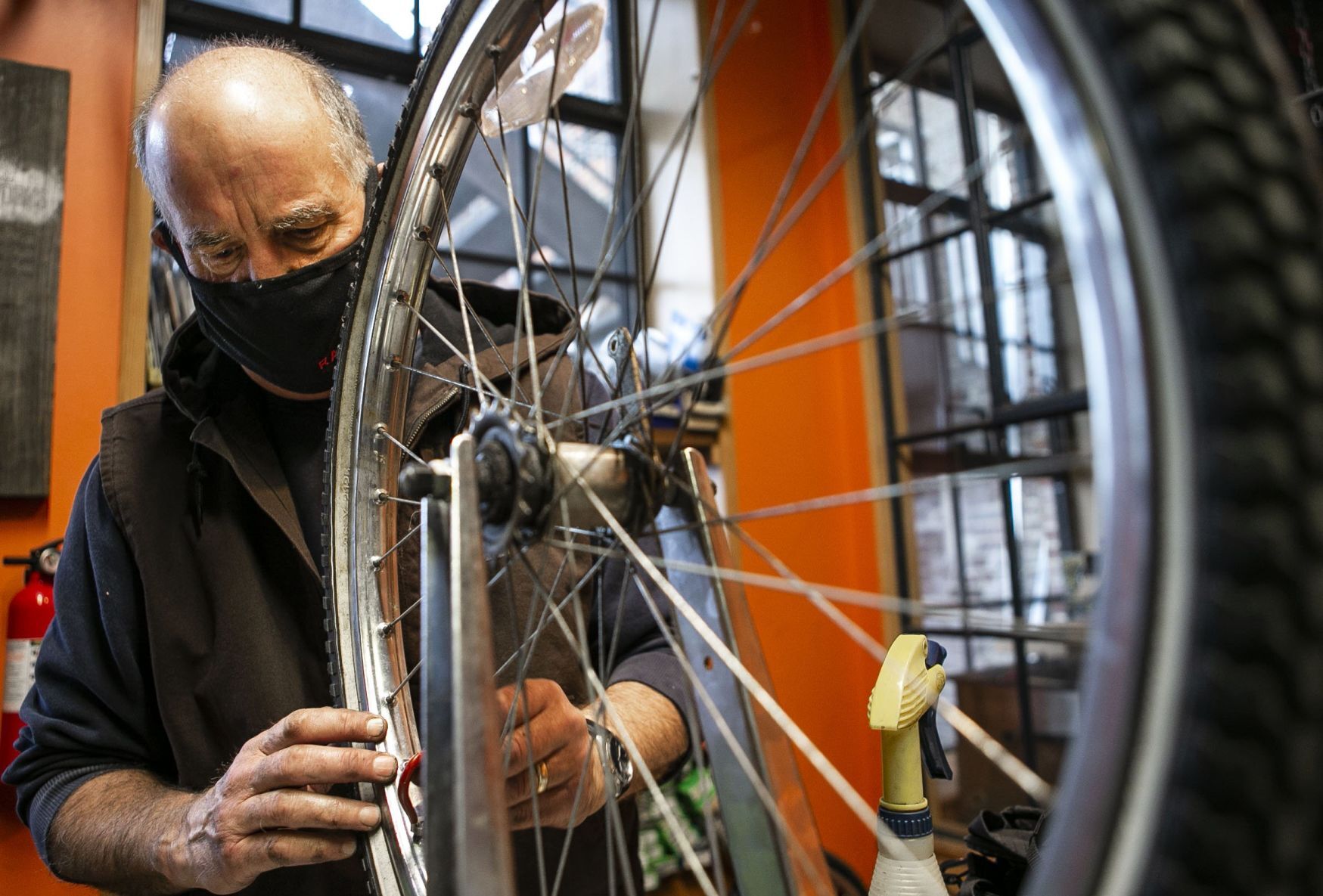 Volunteers and employees repair bikes at St. Louis BWorks in Soulard